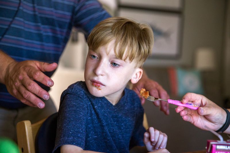 © Karen Haberberg - THOUGH HE IS CAPABLE OF EATING SOFT FOODS, JONATHAN GENERALLY DOES NOT LIKE TO EAT AND IS NOT ABLE TO SELF-FEED.