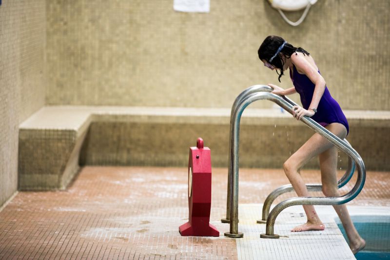 © Karen Haberberg - DESPITE THE METAL RODS ALONG CASSIE’S SPINE, SHE IS A GREAT SWIMMER.