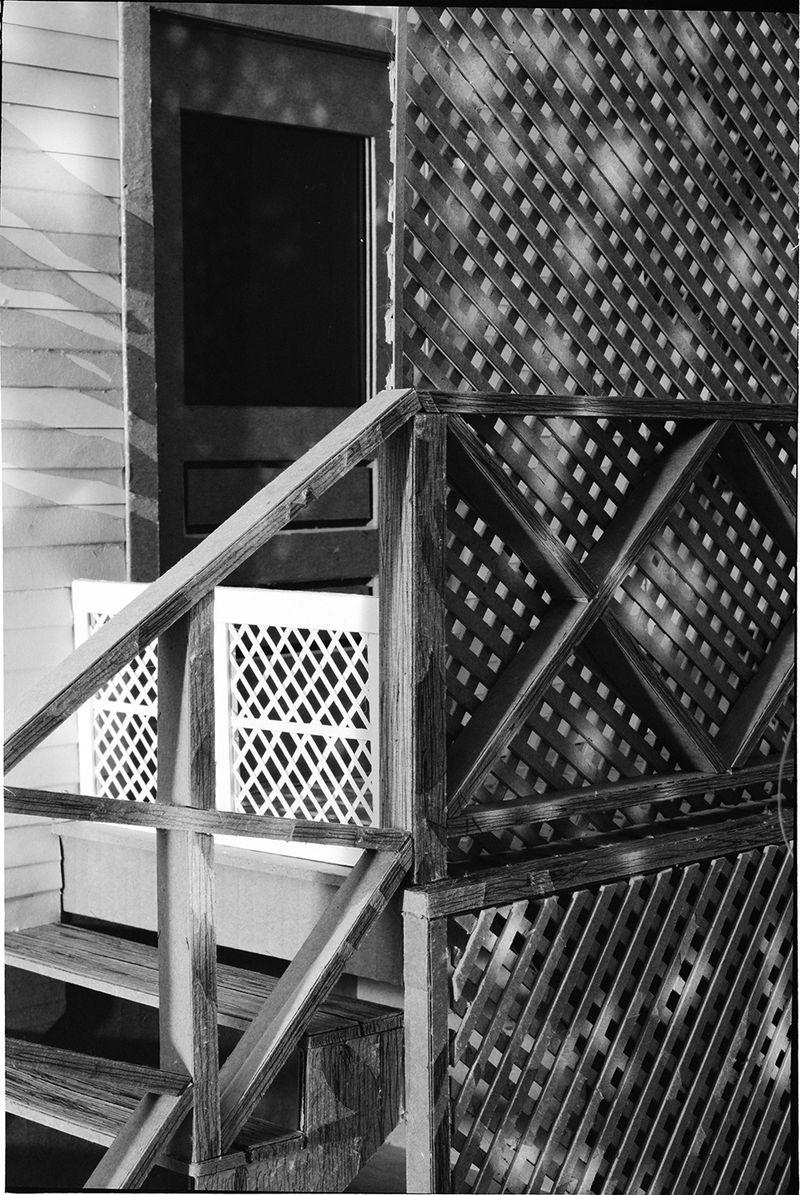 © Robin Crookall - Back Door, 2020, Gelatin silver print, 15 x 22 inches. Photograph of constructed cardboard diorama.