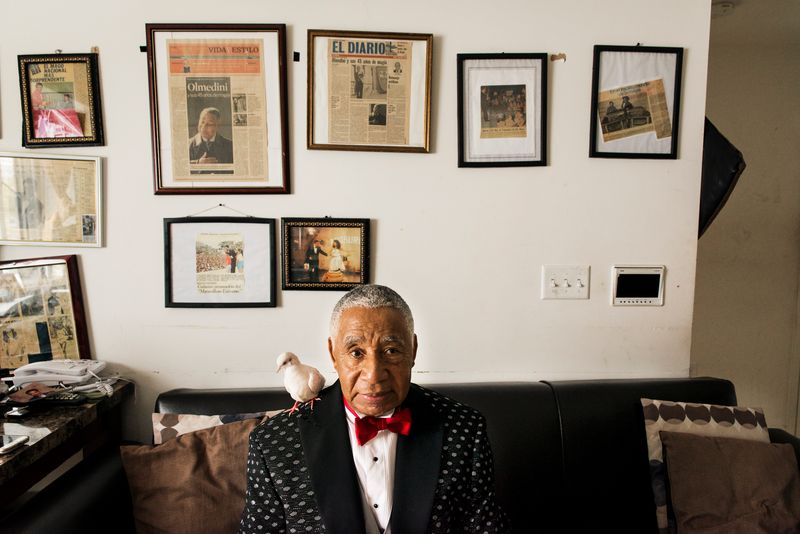 © Jaime Permuth - On the walls of his living room, framed newspaper clippings chronicle the highlights of Olmedini's career in magic.