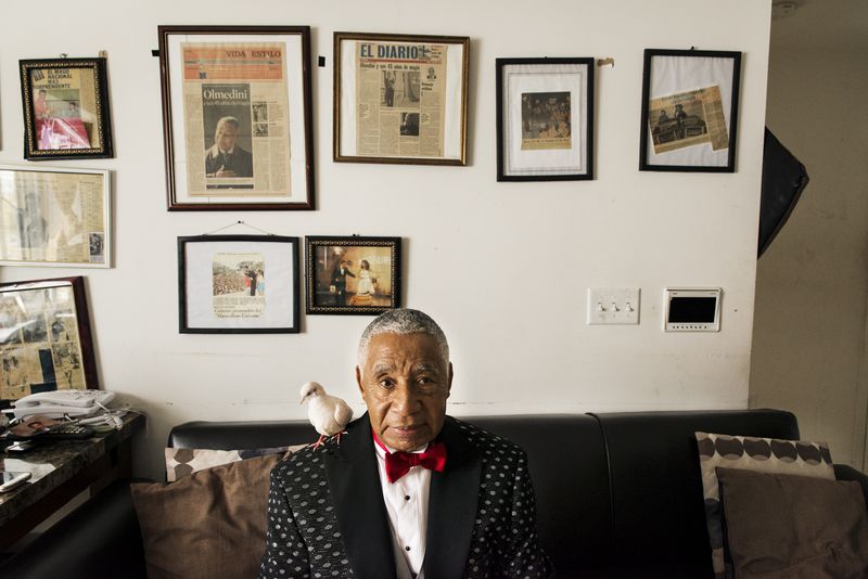 © Jaime Permuth - On the walls of his living room, framed newspaper clippings chronicle the highlights of Olmedini's career in magic.