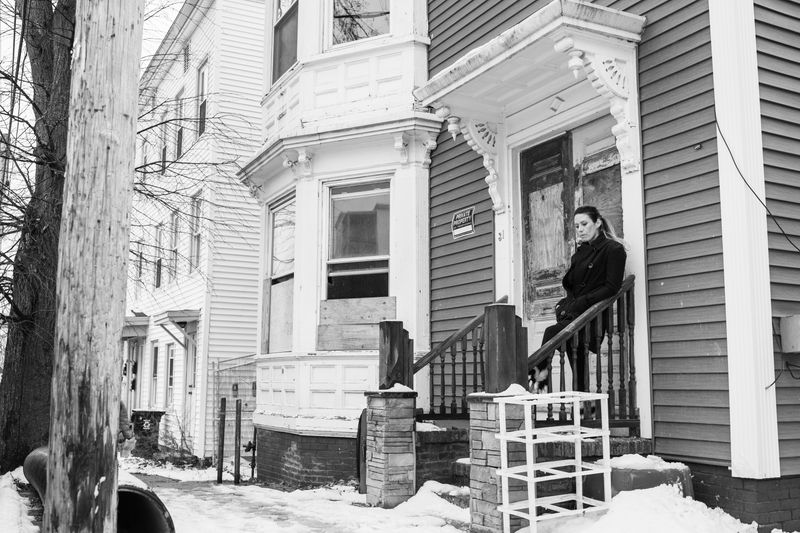 © Matilde Simas - Cary Stuart stands in the doorway of her childhood home in Kennedy Park on East Bayside, Portland ME.