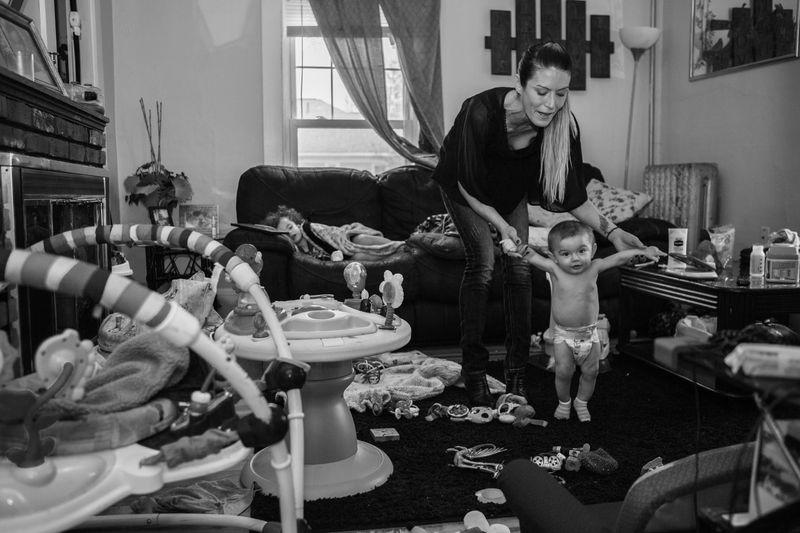 © Matilde Simas - Cary and her 1 year old son, Jay, play in the living room, Biddeford, Maine.