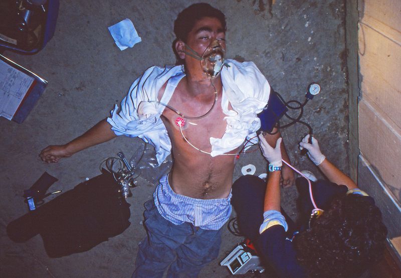 © Richard Street - EMS personnel attempt to revive a Huron farmworker who has overdosed on black tar heroin outside the El Rancho bar.