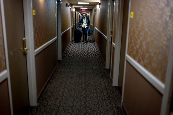 © Ruth Kaplan - Asylum-seeker about to enter cab headed to Roxham Road border crossing.