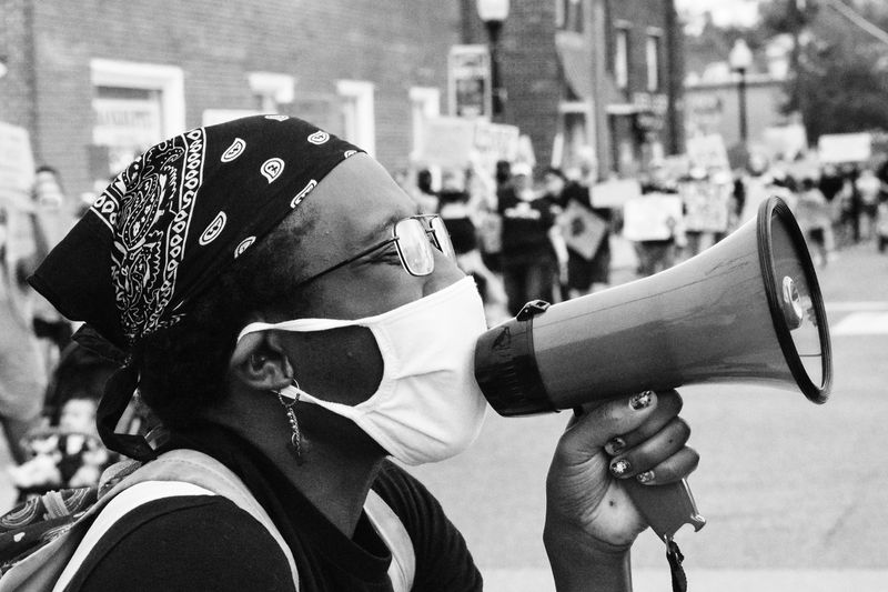 © Ash Esposito ~ Little Box of Random - Protester confronting a heckler "No Justice! No Peace"