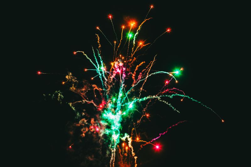 © Ryley Clarke - Colorful fireworks exploding against a dark night sky.