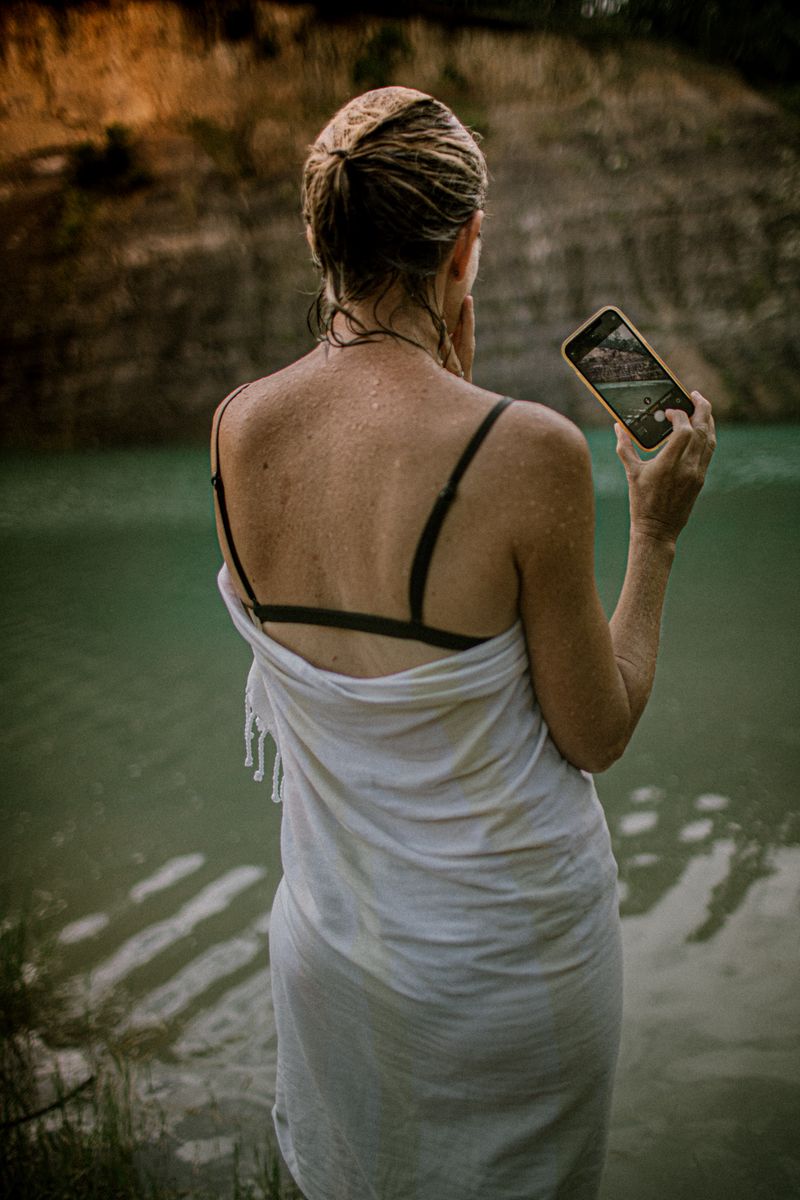© Tajette O'halloran - A mother taking a photo of her son jumping from the rocks