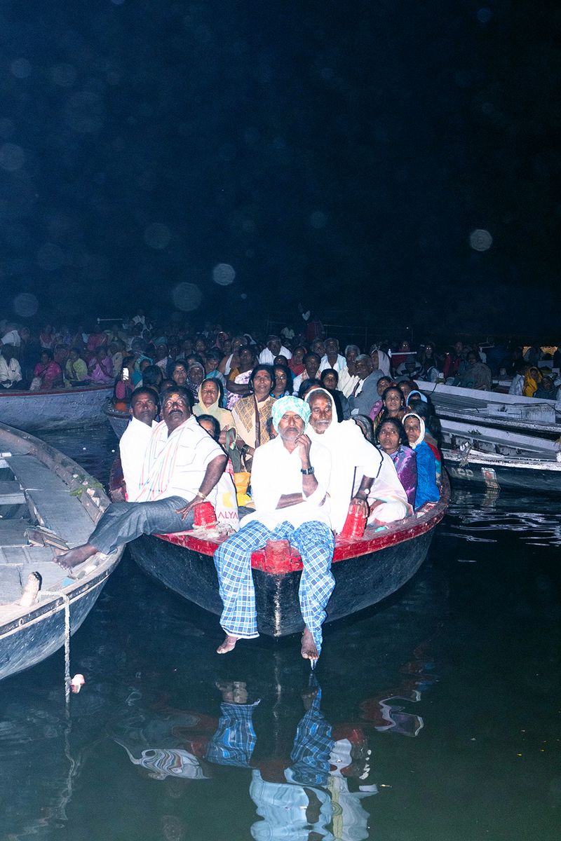 © Kanrapee Chokpaiboon - A group of bystanders watching the Holy fire ceremony.