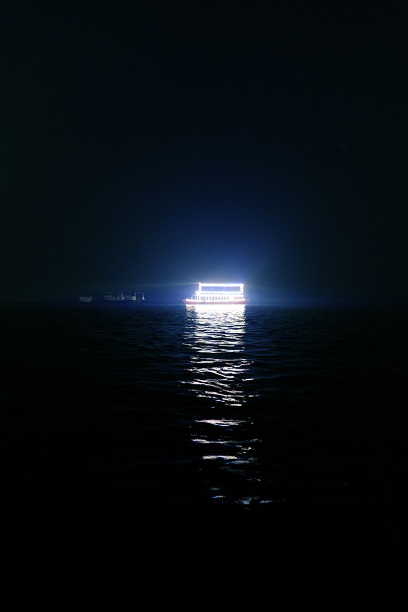 © Kanrapee Chokpaiboon - A tour boat for tourists. Looks godly from afar.