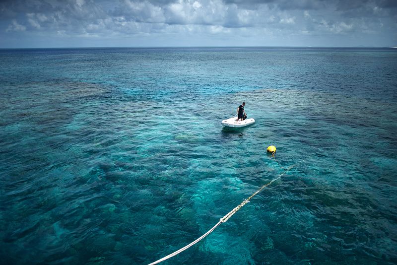 © Giacomo d'Orlando - An operator of Tusa6 is checking from the ocean surface the tourists who are diving through the Hamilton Reef.