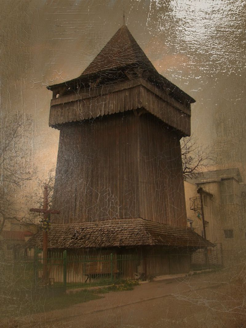 © Andrei  Kolyaskin - Wooden  belfry  from  15th  century  in  town  Drogobych  of  Lviv  region , Ukraine .
