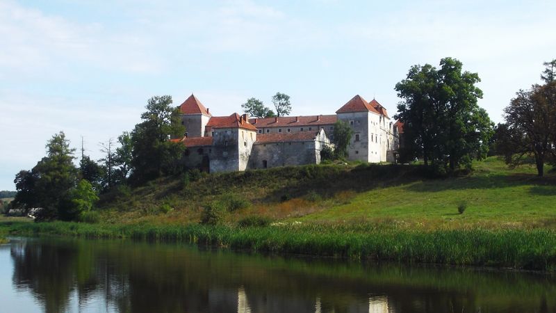 © Andrei  Kolyaskin - Lake  and   Svirzh  Castle  from  15th  century  in   village  Svirzh  of  Lviv  region , Ukraine .