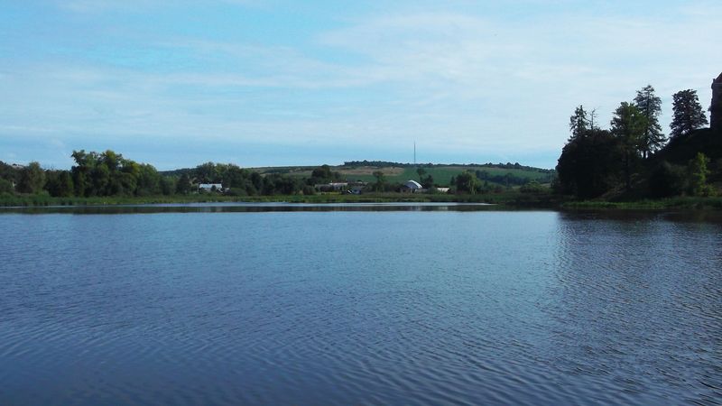 © Andrei  Kolyaskin - Lake  near   Svirzh  Castle  from  15th  century  in   village  Svirzh  of  Lviv  region , Ukraine .
