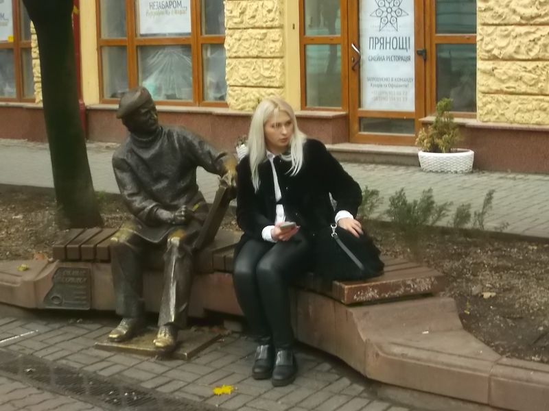 © Andrei  Kolyaskin - Monument  of  ukrainian  painter  Opanas  Zalyvakha  and  old  woman  in  Ivano - Frankivsk  City , Ukraine .