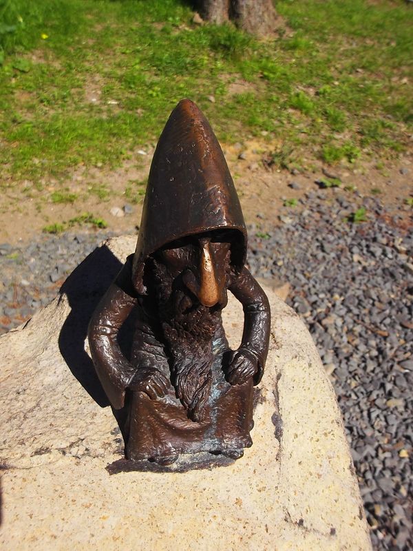 © Andrei  Kolyaskin - Sculpture  of  molfar  on  the  Synevir  pass  of  Mezhygirya  area  of  Zacarpatian  region , Ukraine .