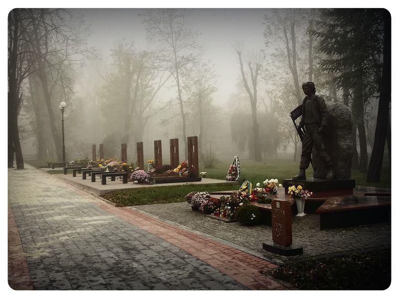 © Andrei  Kolyaskin - Foggy  morning  in  Memorial  Square  of  Ivano - Frankivsk  City , Ukraine .