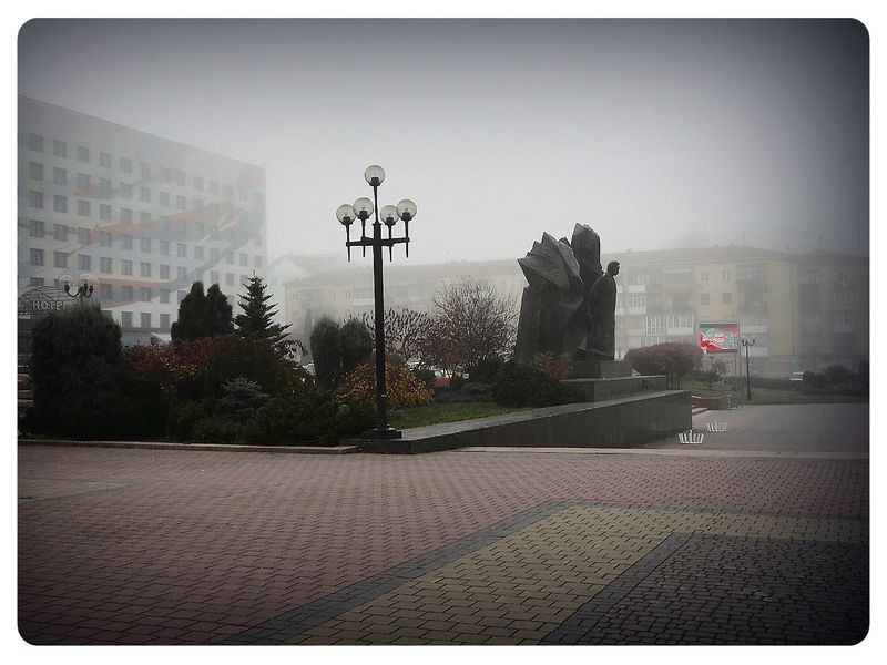 © Andrei  Kolyaskin - Foggy  morning  in  Memorial  Square  of  Ivano - Frankivsk  City , Ukraine .