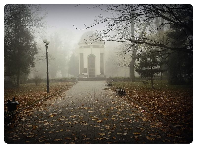 © Andrei  Kolyaskin - Foggy  morning  in  Memorial  Square  of  Ivano - Frankivsk  City , Ukraine .