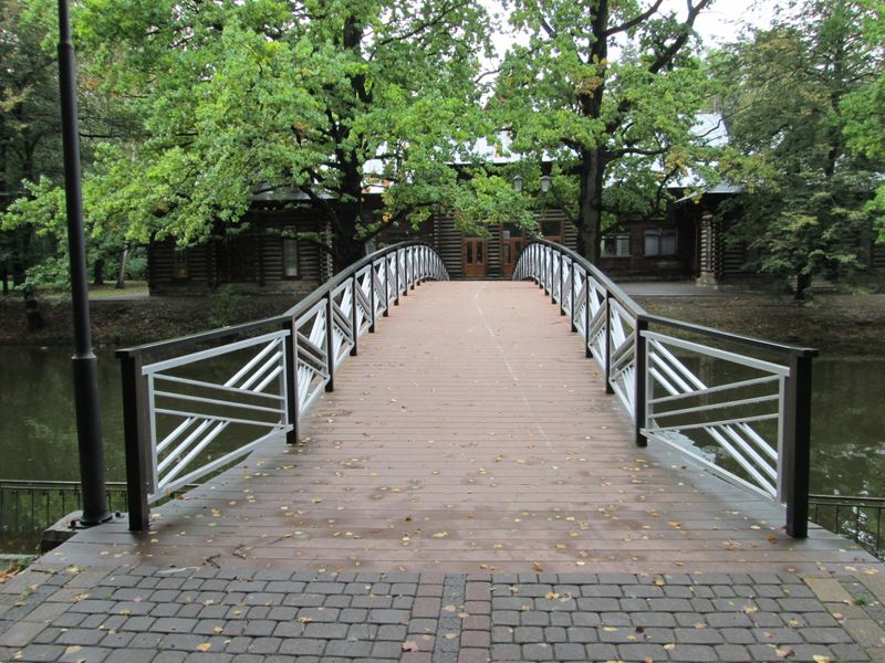© Andrei  Kolyaskin - Bridge  through  the  pond  on  the  central  park  of  Ivano - Frankivsk  City , Ukraine .