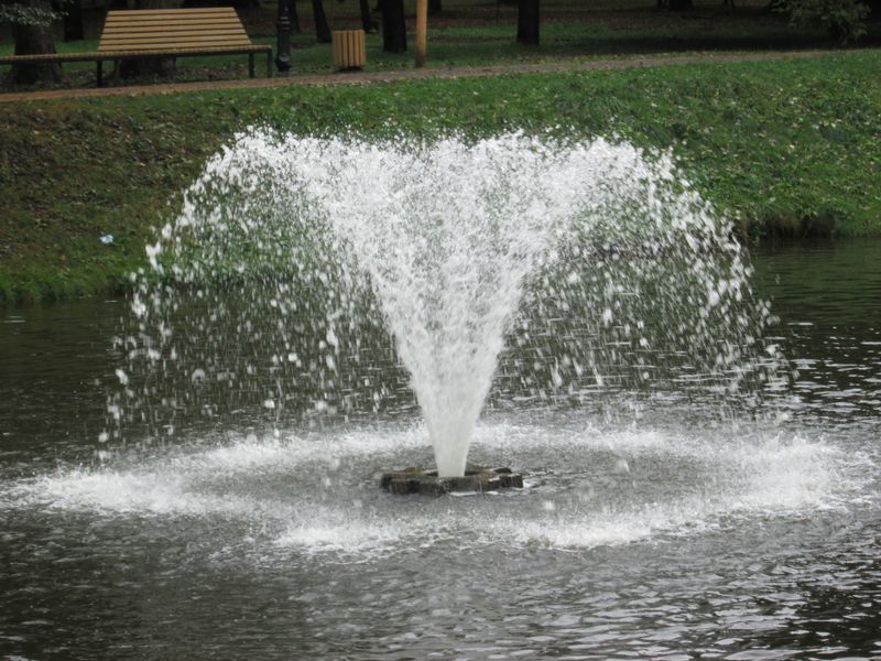 © Andrei  Kolyaskin - Fountain  on  the  pond  of  central  park  of  Ivano - Frankivsk  City , Ukraine .