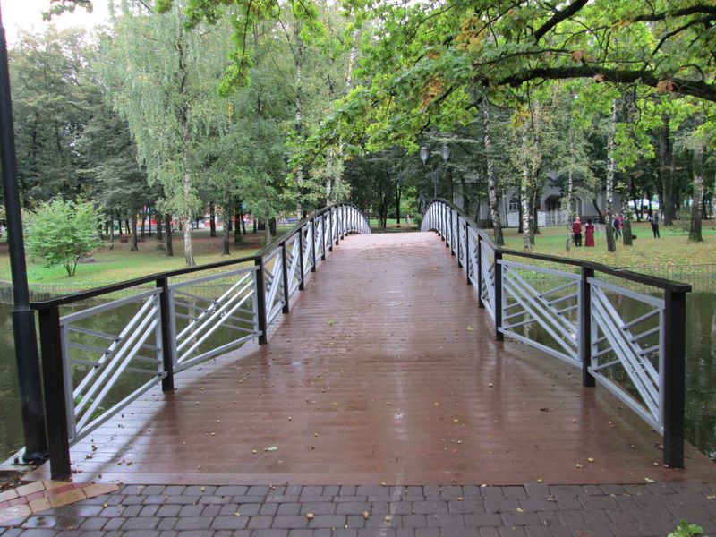 © Andrei  Kolyaskin - Bridge  through  the  pond  on  the  central  park  of  Ivano - Frankivsk  City , Ukraine .