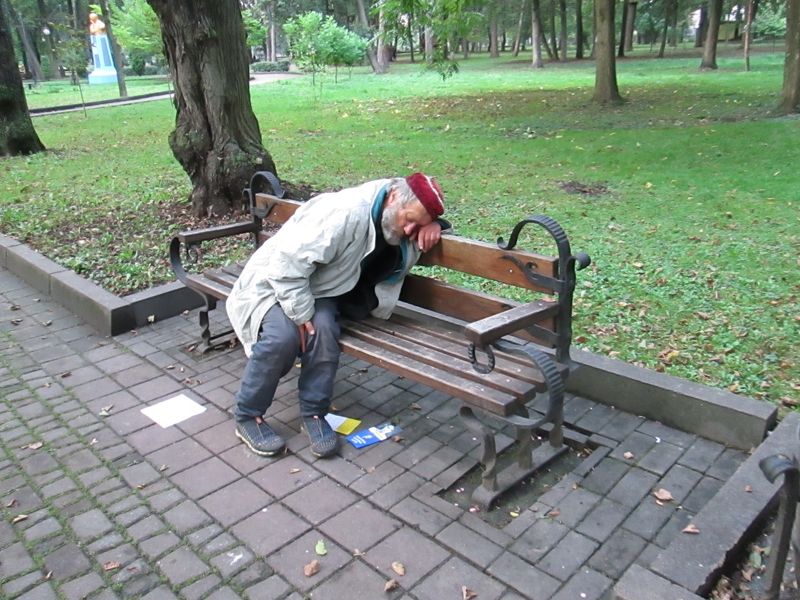© Andrei  Kolyaskin - Drunkard  on  the  central  park  of  Ivano - Frankivsk  City , Ukraine .