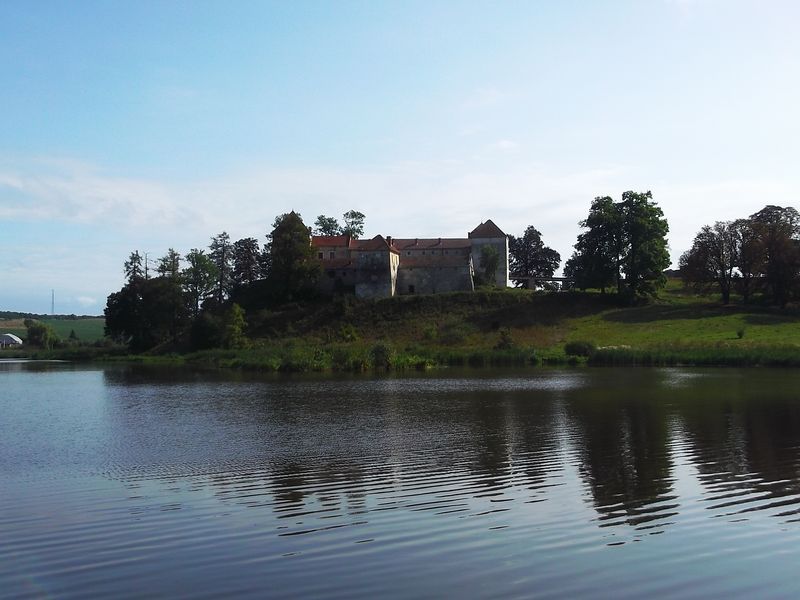 © Andrei  Kolyaskin - Lake  and  Svirzh  Castle  from  15th  century  in  village  Svirzh  of  Lviv  region , Uktaine .