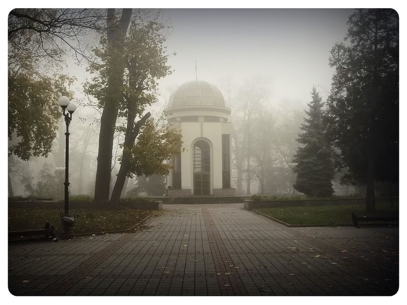 © Andrei  Kolyaskin - Foggy  autumn  morning  on  the  Memorial  Square  of  Ivano - Frankivsk  City , Ukraine .