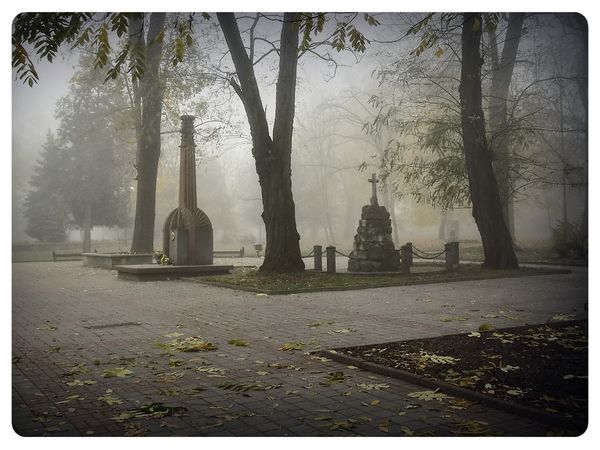 © Andrei  Kolyaskin - Foggy  autumn  morning  on  the  Memorial  Square  of  Ivano - Frankivsk  City , Ukraine .
