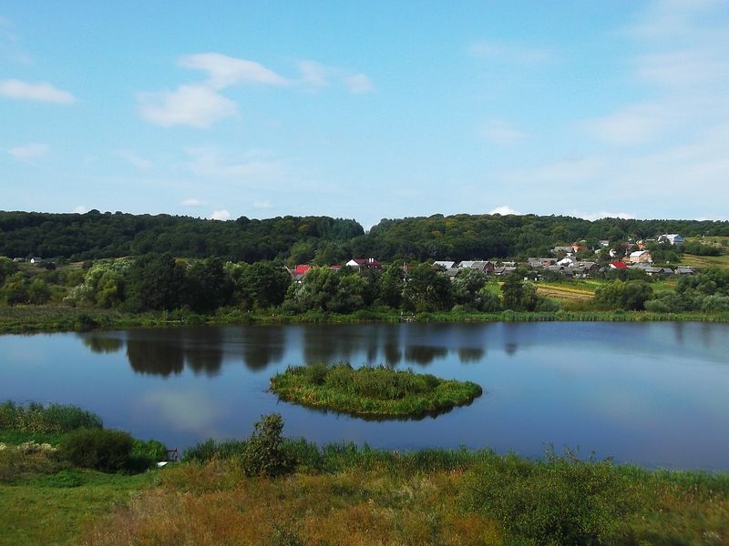 © Andrei  Kolyaskin - Lake  near  Svirzh  Castle  from  15th  century  in  village  Svirzh  of  Lviv  region , Ukraine .