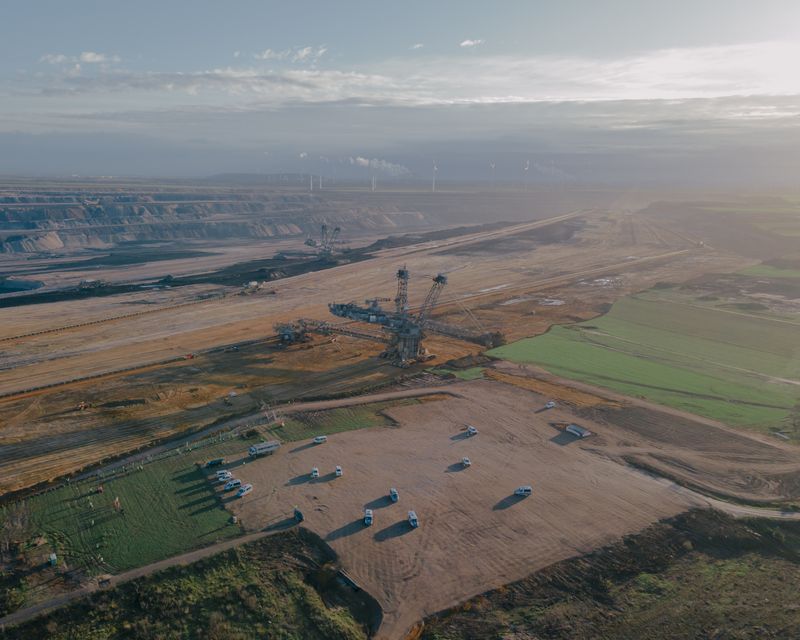 © Ingmar Björn Nolting - Aerial view over Garzweiler II open pit lignite mine and police cars in Lützerath, Germany on 08 January 2023.