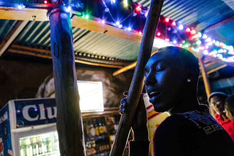 © Jake Naughton - Javan, a young transgender woman, sings along to the music during a night out at Ram.