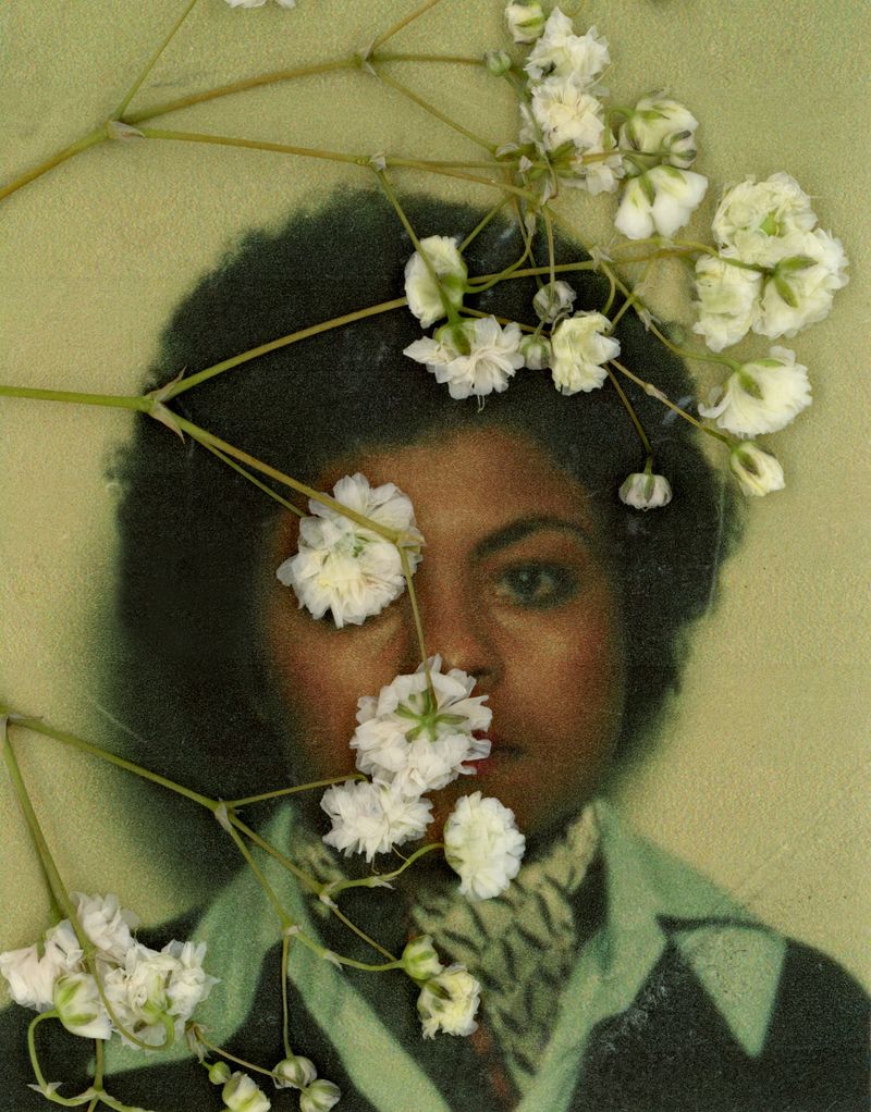 © Daniela Spector - An identification photo of my mother, with her gaze fixed on the camera, lapel slightly askew, layered with dried flowers.