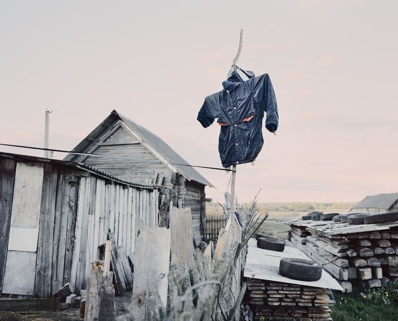 © Jasper Walter Bastian - A scarecrow protecting the garden of an older couple in Stalgonys. Stalgonys, Lithuania, 2015.