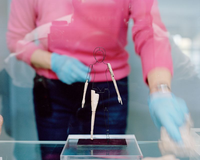 © Valentin Derom - Conservator tending to the remnants of a roman doll, Arles Antiques Museum