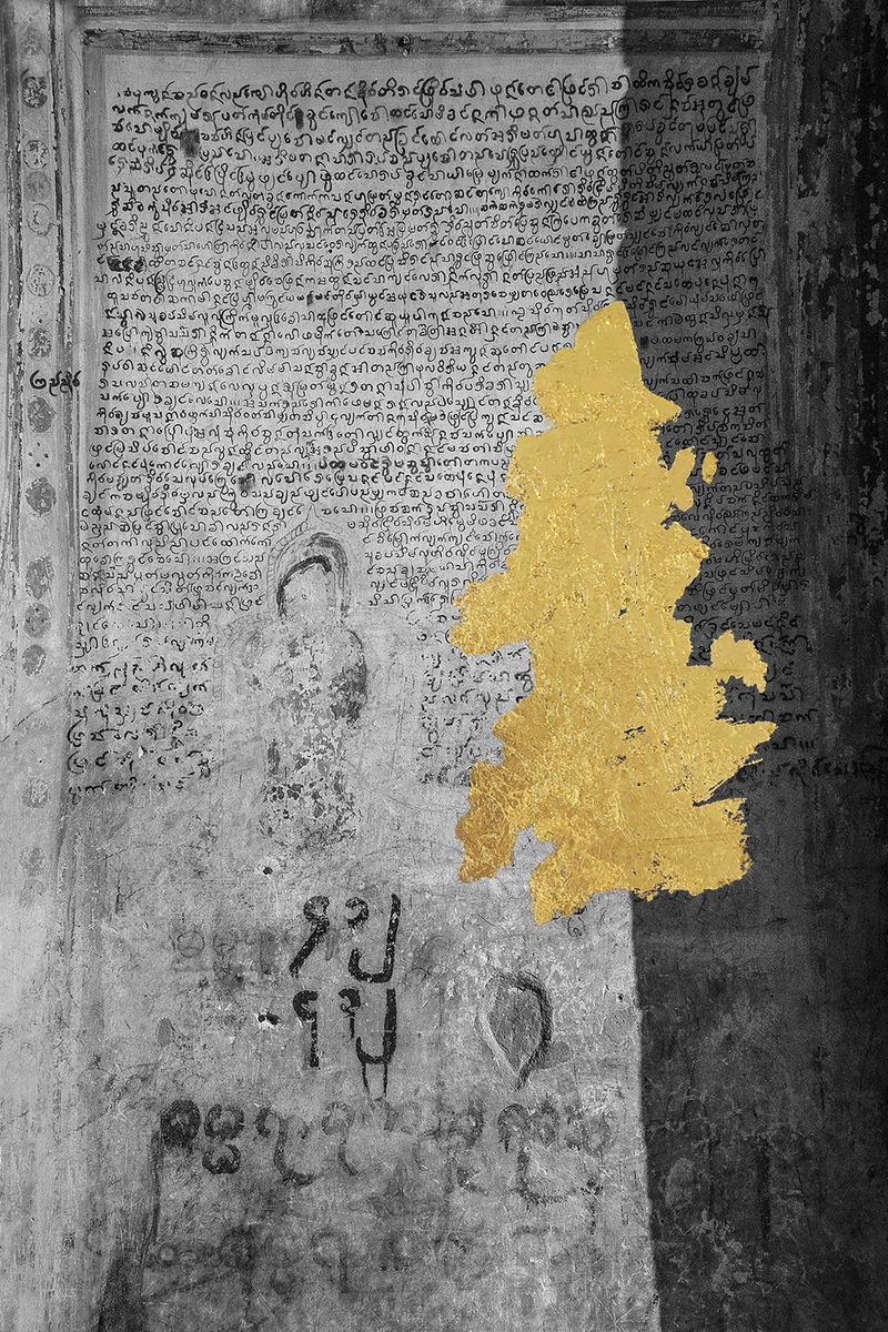 © andrea alkalay - Kutho / Scriptures (Holy writings from a pagoda wall with a blurred Buddha.Gold intervention )