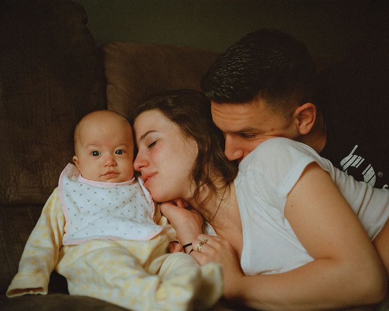 © Bridget Badore - Ben & Anna on Their Couch with Laura, 2018