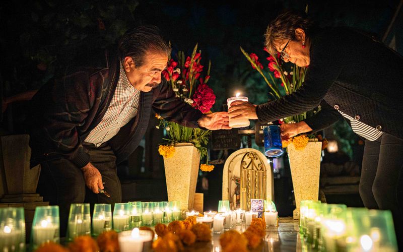 © Hong Yu Chan - Hands meet above a candle, passing flame from one generation to another.