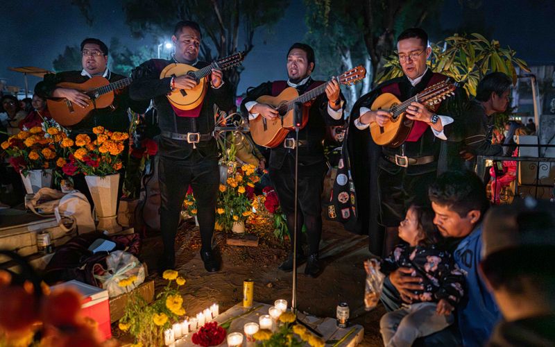 © Hong Yu Chan - Music fills the cemetery, turning grief into shared rhythm and warmth.