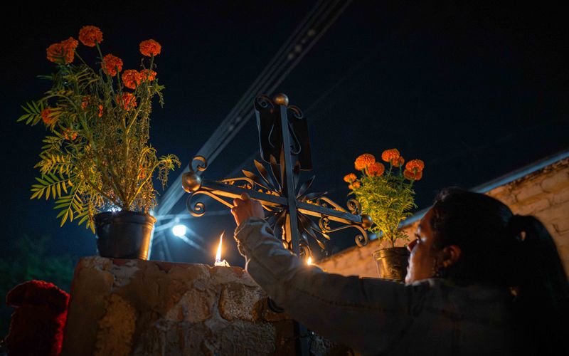 © Hong Yu Chan - A quiet gesture reaches upward, placing light among flowers and shadow.