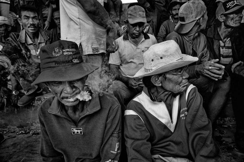 © Alain Schroeder - Indonesia, Sumbawa Island, Moyo, Men watching the races in the tribune.