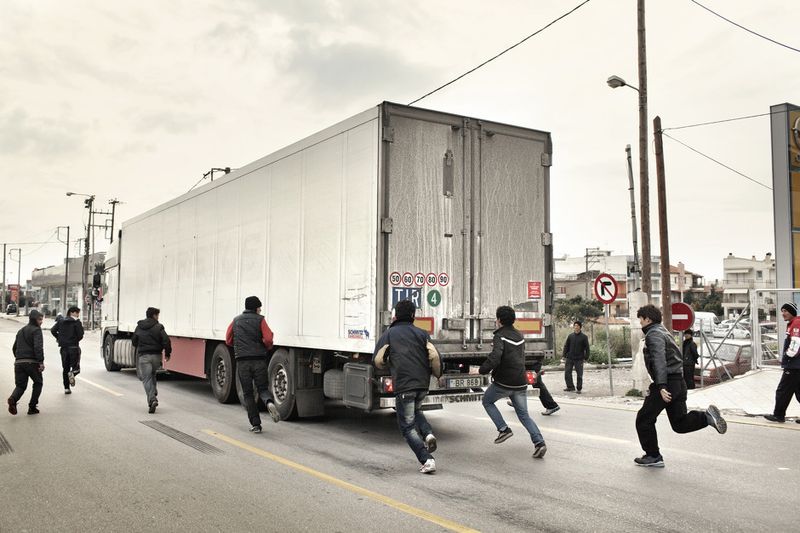 © Alessandro Penso - 2012. Patras. Greece.. A group of adolescents from Afghanistan trying to illegally board trucks going to Italy.