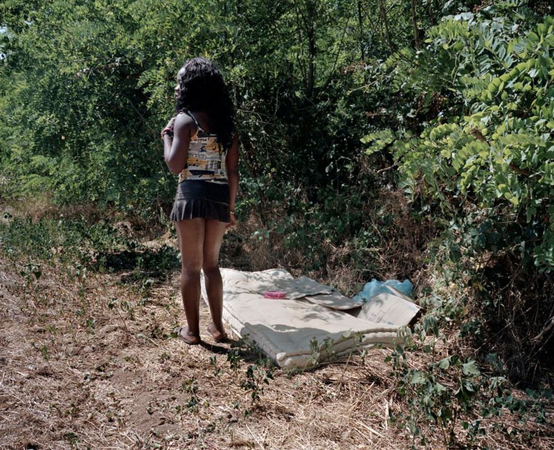 © Paolo Patrizi - Angela, a sex worker, stands by her makeshift bed, Rome, Italy