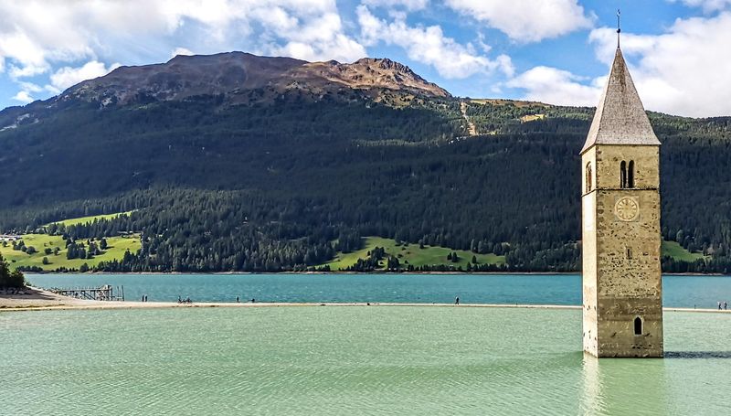 © Jürgen Joherl - The famous church tower of Graun survived the flooding of the whole valley @Reschensee