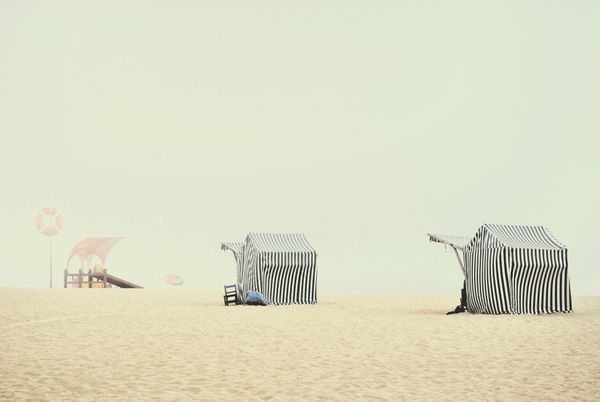 © Eduardo Rosas - Striped beach tents in morning haze, Portuguese Atlantic coast.
