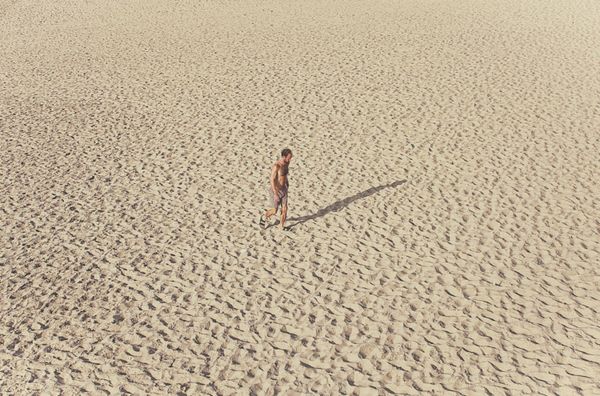 © Eduardo Rosas - A solitary figure crossing the sand at low tide