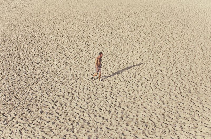 © Eduardo Rosas - A solitary figure crossing the sand at low tide