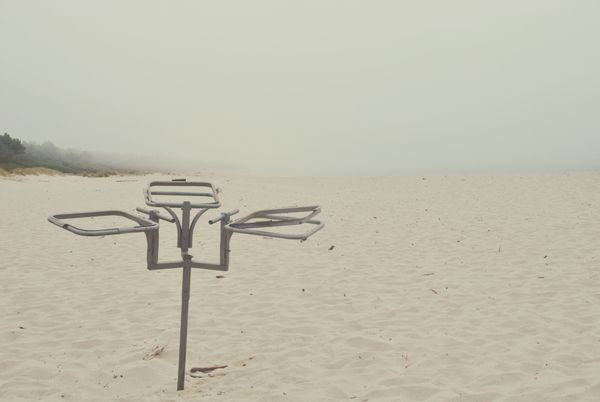 © Eduardo Rosas - Unused metal waste-bag frame on the beach.