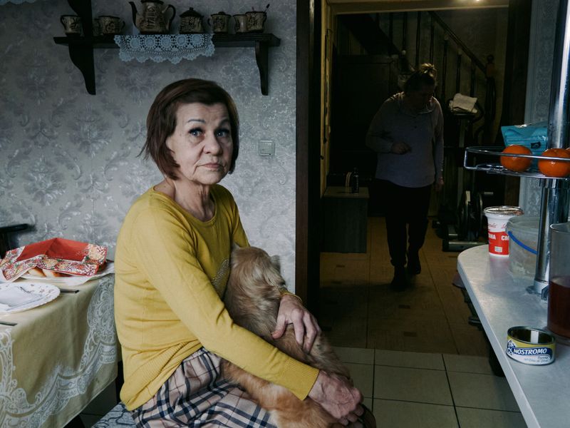© Anastasia Miseyko - Shot of Tatiana Miseyko, comforting her dog during an airstrike.